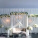 ELEGANT FLORAL OASIS: White Draped Backdrop with Crystal Chandeliers